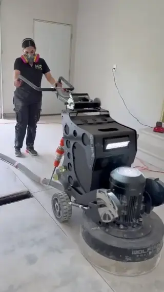 Diamond grinding concrete surface prep in a Green Bay garage