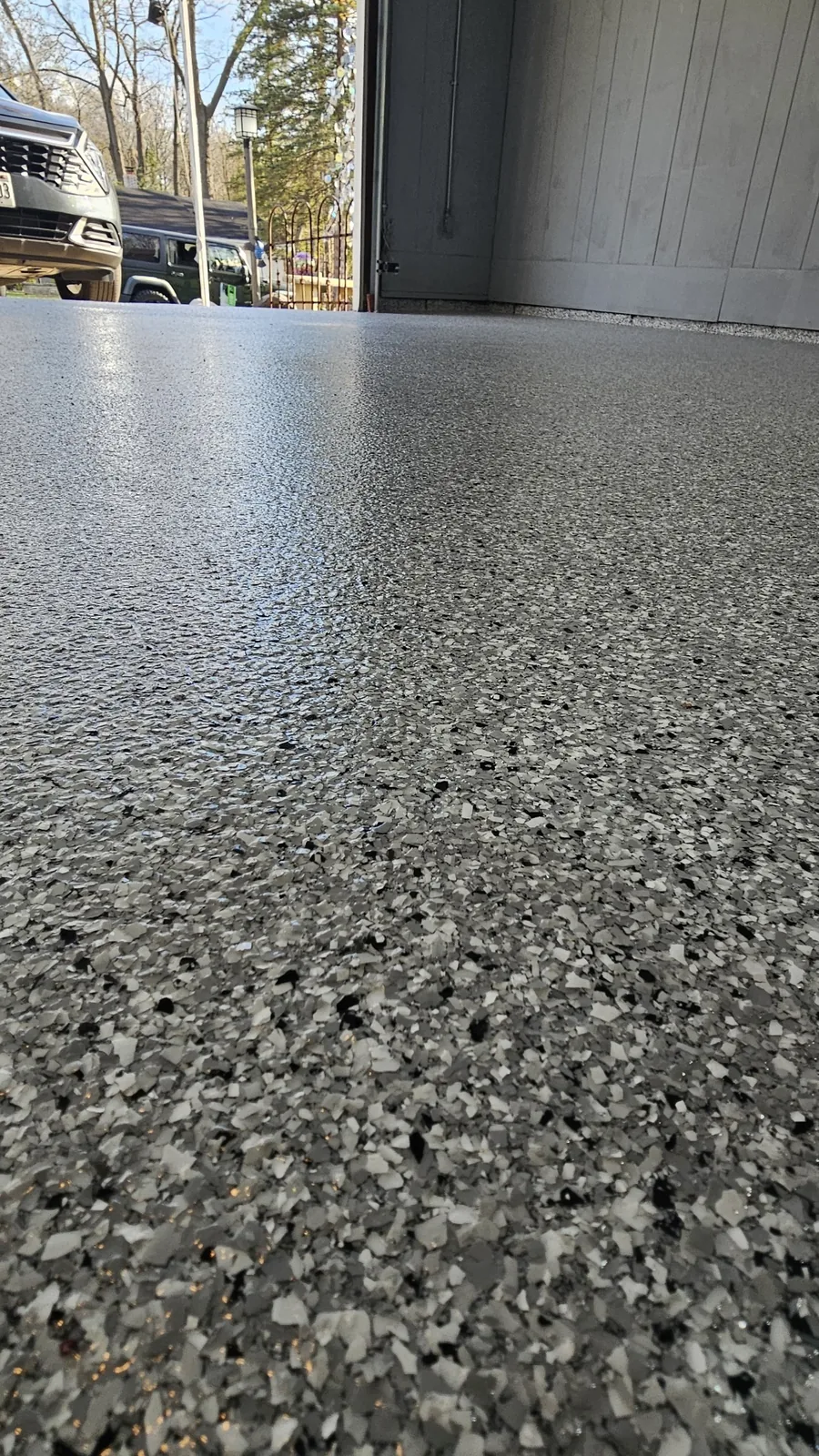 Close-up of glossy flake epoxy garage coating