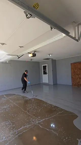 Epoxy garage floor installation in progress