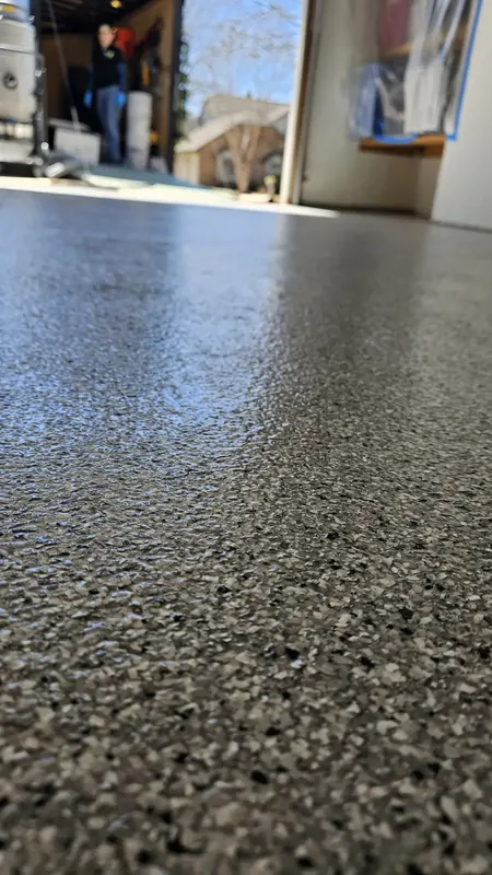 Glossy flake epoxy garage floor with polyaspartic top coat in Appleton, WI