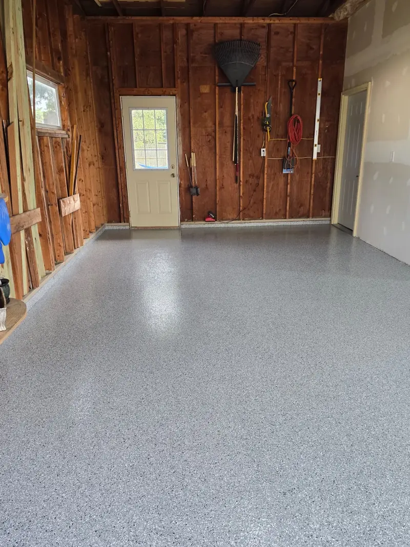 Feather Gray flake garage floor facing the side door and tool wall, Marinette, WI
